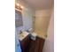 Bathroom with stylish vanity, wood look flooring, and walk in shower at 5129 Sugarfoot Ave, Las Vegas, NV 89107