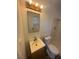 Well lit bathroom featuring a vanity with countertop, and tiled shower at 5129 Sugarfoot Ave, Las Vegas, NV 89107