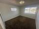 Well-lit bedroom with plush carpet, two windows and neutral paint at 5129 Sugarfoot Ave, Las Vegas, NV 89107