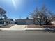 Single-story home featuring a two car garage and low maintenance landscaping at 5129 Sugarfoot Ave, Las Vegas, NV 89107