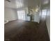 Neutral living room showcasing an open floor plan, carpet, and lots of natural light at 5129 Sugarfoot Ave, Las Vegas, NV 89107