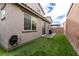A well-maintained backyard with green artificial turf offers low maintenance and year-round beauty at 6130 Sinks Canyon Ave, Las Vegas, NV 89130