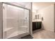 Bathroom featuring a shower, double vanity, and modern fixtures with neutral finishes at 6130 Sinks Canyon Ave, Las Vegas, NV 89130