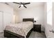 Comfortable bedroom with plush carpeting, ceiling fan, and closet with sliding doors at 6130 Sinks Canyon Ave, Las Vegas, NV 89130