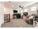 Upstairs bonus room with desk, ceiling fan, and plenty of space for activities at 6130 Sinks Canyon Ave, Las Vegas, NV 89130