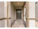 Covered front porch with stone pillars and a dark front door at 6130 Sinks Canyon Ave, Las Vegas, NV 89130