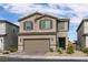 Charming two-story home with a two car garage and desert landscaping in a Gathering-friendly neighborhood at 6130 Sinks Canyon Ave, Las Vegas, NV 89130