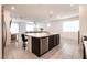 Spacious kitchen with large center island, stainless steel dishwasher, and open layout at 6130 Sinks Canyon Ave, Las Vegas, NV 89130