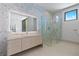 Chic bathroom offers a glass shower, modern vanity, and mosaic tile at 63 Midnight Sky Dr, Las Vegas, NV 89135