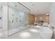 A luxurious bathroom features an elegant soaking tub and a spacious glass-enclosed shower with double shower heads at 63 Midnight Sky Dr, Las Vegas, NV 89135