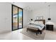 This bedroom features large sliding glass doors offering a seamless connection to the outdoors at 63 Midnight Sky Dr, Las Vegas, NV 89135