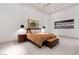 Minimalist bedroom with accent lighting, modern furniture, and neutral tones, creating a serene retreat at 63 Midnight Sky Dr, Las Vegas, NV 89135