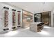 This modern kitchen features a wine rack and center island with bar seating at 63 Midnight Sky Dr, Las Vegas, NV 89135
