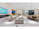 Bright living room featuring a fireplace, modern design, and expansive views with access to the pool at 63 Midnight Sky Dr, Las Vegas, NV 89135