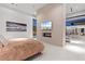 This main bedroom features a modern fireplace and a wall-mounted television at 63 Midnight Sky Dr, Las Vegas, NV 89135
