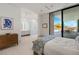 Bright main bedroom featuring a seamless indoor-outdoor design with access to the pool and outdoor dining area at 63 Midnight Sky Dr, Las Vegas, NV 89135