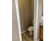 Small bathroom with commode, oak vanity and solid surface countertop at 6608 Elk Creek Ln, Las Vegas, NV 89156