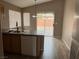 Functional kitchen with essential appliances, laminate countertops, and convenient access to the backyard at 6608 Elk Creek Ln, Las Vegas, NV 89156