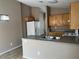 Practical kitchen featuring ample cabinet space, essential appliances, and a breakfast bar for everyday meals at 6608 Elk Creek Ln, Las Vegas, NV 89156