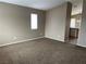 Cozy living room with neutral walls and plush carpeting, creating a warm and inviting atmosphere at 6608 Elk Creek Ln, Las Vegas, NV 89156