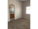 Inviting primary bedroom featuring neutral walls, carpet flooring, and an en-suite bathroom for added privacy at 6608 Elk Creek Ln, Las Vegas, NV 89156