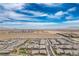 Panoramic aerial view capturing neighborhood layout with desert backdrop and wide-open sky at 6630 Windy Palm St, North Las Vegas, NV 89086