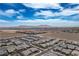Expansive aerial capturing the community's setting with desert scenery and distant mountains at 6630 Windy Palm St, North Las Vegas, NV 89086