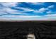 Overhead photo focuses on a house in a desert neighborhood, providing a clear layout of the area at 6630 Windy Palm St, North Las Vegas, NV 89086