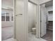 White-painted bathroom featuring toilet and doorway to walk-in closet at 6630 Windy Palm St, North Las Vegas, NV 89086