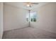 Bright bedroom with neutral walls, soft carpet, and natural light at 6630 Windy Palm St, North Las Vegas, NV 89086