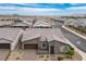 Inviting single-Gathering home showcasing a driveway with brick pavers and a covered entryway, perfect for curb appeal at 6630 Windy Palm St, North Las Vegas, NV 89086