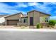 Charming single-story home featuring a desert landscaped front yard and two-car garage at 6630 Windy Palm St, North Las Vegas, NV 89086