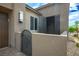 A stylish courtyard at the front entrance with wrought iron gate and stone pavers at 6630 Windy Palm St, North Las Vegas, NV 89086