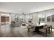 Open-concept living and dining area with fireplace, neutral tones and ample natural light at 6630 Windy Palm St, North Las Vegas, NV 89086
