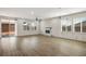 Open-concept living room features a fireplace, sliding glass doors, and vinyl floors at 6630 Windy Palm St, North Las Vegas, NV 89086