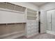 Well-organized walk-in closet boasts shelves and drawers for optimal storage at 6630 Windy Palm St, North Las Vegas, NV 89086