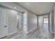 Bright hallway features wood-look floors, neutral walls, and access to various rooms at 6631 S Parkwood Ct, Pahrump, NV 89061