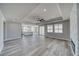 The living room features an open floorplan, with recessed ceilings and gray wood-look floors at 6650 Raintree Ct, Pahrump, NV 89061