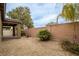 Backyard featuring desert landscaping, tall privacy wall, and desert landscaping at 6925 Cuddy Falls Pl, North Las Vegas, NV 89084