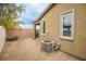 Low-maintenance backyard featuring gravel landscaping, a brick wall, and a small palm tree at 6925 Cuddy Falls Pl, North Las Vegas, NV 89084