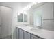Clean bathroom with double sinks, sleek vanity, and contemporary fixtures and finishes at 6925 Cuddy Falls Pl, North Las Vegas, NV 89084
