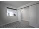 Bright room featuring modern flooring and an open pass-through to the kitchen at 6925 Cuddy Falls Pl, North Las Vegas, NV 89084
