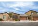 Charming one-story home with a well-manicured front yard and a two-car garage at 6925 Cuddy Falls Pl, North Las Vegas, NV 89084