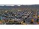 Great aerial shot of community, with mountain views in the background, and night street lighting at 7148 Stanley Frederick St, Las Vegas, NV 89166