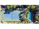 Aerial view of community with tennis court, pool, landscaping, and building at 7155 S Durango Dr # 303, Las Vegas, NV 89113