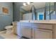 Bathroom features a spacious vanity, large mirror and good lighting and neutral color scheme at 7155 S Durango Dr # 303, Las Vegas, NV 89113