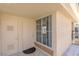 Exterior door view with small patio area, offering a glimpse of the living space and natural light at 7155 S Durango Dr # 303, Las Vegas, NV 89113