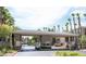 Daytime view of community entry gate and surrounding palm trees at 7155 S Durango Dr # 303, Las Vegas, NV 89113