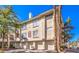 Charming condo featuring multi-level with private garages, lush landscaping and classic desert architecture at 7155 S Durango Dr # 303, Las Vegas, NV 89113