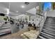 Well-equipped gym featuring treadmills, bikes, and free weights with stairs in view at 7155 S Durango Dr # 303, Las Vegas, NV 89113